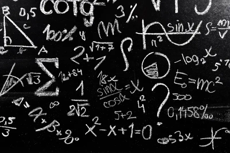 A blackboard with a bunch of math on it